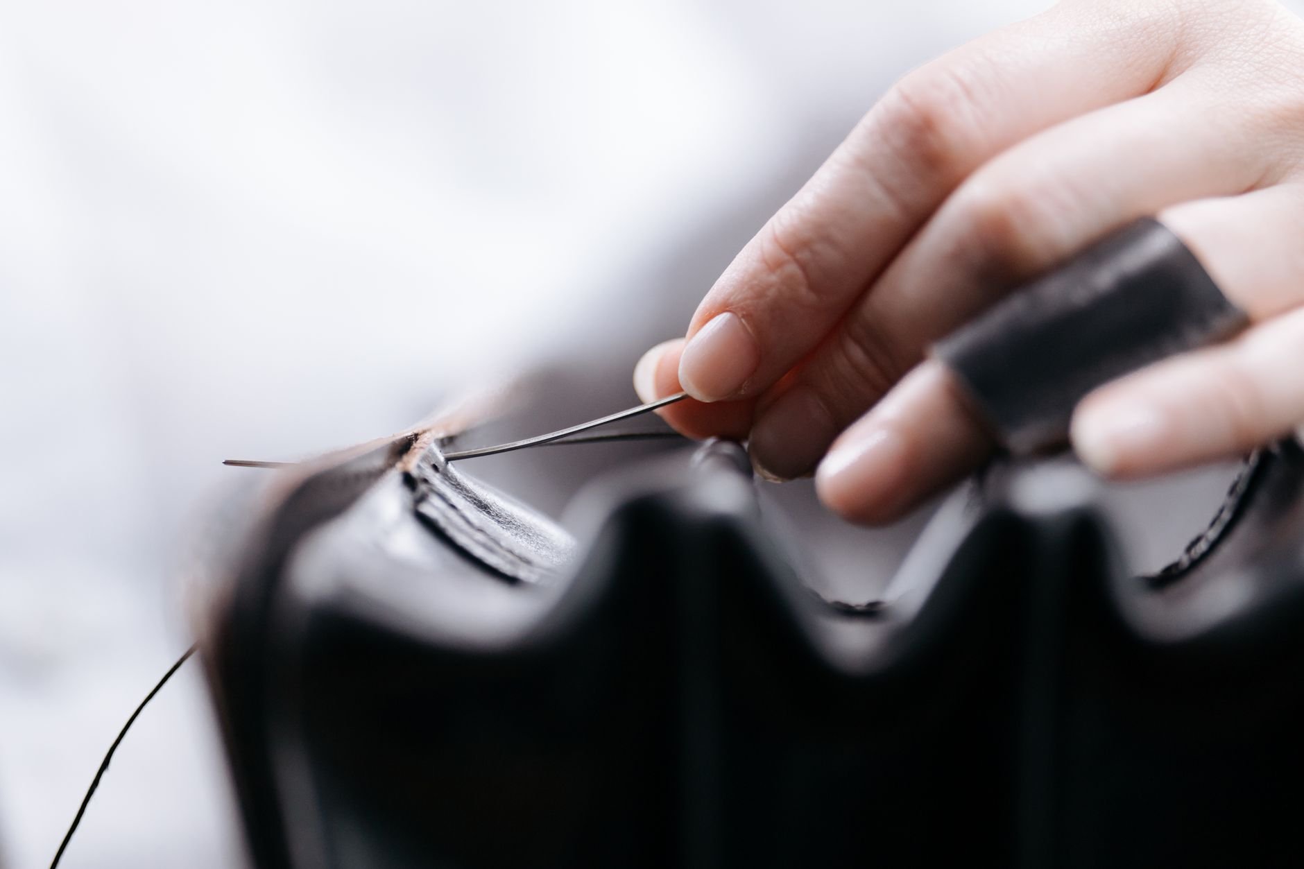 Close-up of a beautifully crafted leather handbag, showing fine stitching and detail.
